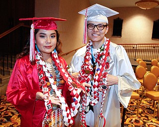 ROBERT K YOSAY  | THE VINDICATOR..From Mexico with love as Shaundey  Young and Shaine  Young had lNecklace lays made from memories by their sister from Mexico..Friends and family cried out with joy Friday night as the 115 graduates in Chaney High SchoolÕs Class of 2018 entered Stambaugh Auditorium...-30-