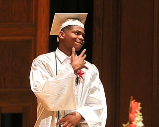 ROBERT K YOSAY  | THE VINDICATOR..Elijah Donley....  signals the crowd as he does his walk..Friends and family cried out with joy Friday night as the 115 graduates in Chaney High SchoolÕs Class of 2018 entered Stambaugh Auditorium...-30-