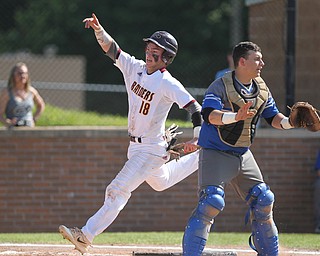 Jared Bajerski (18) of South Range celebrates as he steps on home plate as Grand Valley catcher Gary Gearhart (20) waves off the throw during Friday nights Regional Finals matchup at Massilon High School. Dustin Livesay  |  The Vindicator  5/25/18  Massilon.