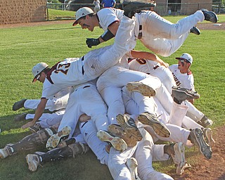 The South Range baseball team piles upon each other after defeating Grand Valley 4-2 on Friday evening's Regional Championship game at Massilon High School. Dustin Livesay  |  The Vindicator  5/25/18  Massilon.