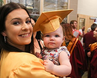 ROBERT K YOSAY  | THE VINDICATOR..South Range Class of 2018Õs , High School Principal Stephen P. Rohan described its 120 graduates a Òone of a kind class.Ó..Happy Time for her niece as Lexie Davis holds Brynlee Davis   with her mortarboard......-30-