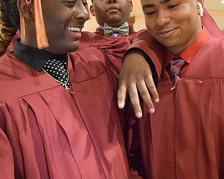 William D. Lewis The Vindicator Mooney grads from left, Antonio Riley, Kris Winford and Willie Young talke a selfie before 5-27-18 commencement at Stambaugh Auditorium.