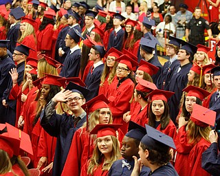             ROBERT  K. YOSAY | THE VINDICATOR..Graduate survey the crowds for friends and families..Austintown Fitch 2018  Sunday afternoon at the Gymnasium
