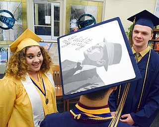 William D. Lewis The Vindicator Lowellville valedictorian Nathanael (correct) Warren who is a Sinatra fan wrote a unique message on his mortar board. He is shown talking with fellow Lowellville grads Mercedes Santiago and Zachary Schenk.