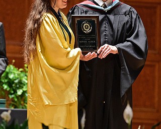 YOUNGSTOWN, OHIO - MAY 27, 2018: Sophie Alper gets her Salutatorian plaque from Principal Matthew Sammartino during the Ursuline High School graduation ceremony, Sunday afternoon at Stambaugh Auditorium. DAVID DERMER | THE VINDICATOR