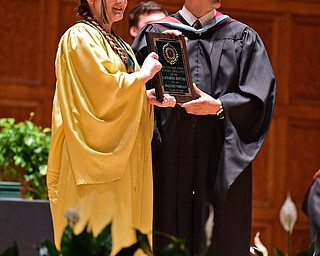 YOUNGSTOWN, OHIO - MAY 27, 2018: Katharine Repetski gets her Valedictorian plaque from Principal Matthew Sammartino during the Ursuline High School graduation ceremony, Sunday afternoon at Stambaugh Auditorium. DAVID DERMER | THE VINDICATOR