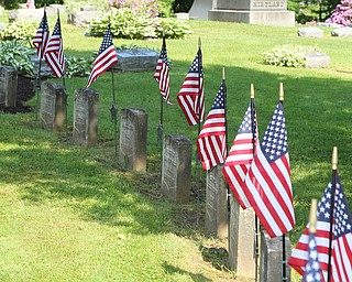 1500 flags are placed on grave sites of fallen soldiers as they are honored during the Memorial Day Parade and ceremony in Poland on Monday morning. Dustin Livesay  |  The Vindicator  5/28/18 Poland