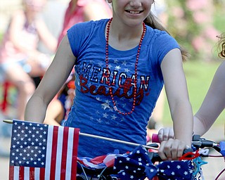 Alexis Antal (12) of Poland decorated her bike and rode in the Memorial Day Parade at Poland on Monday morning. Dustin Livesay  |  The Vindicator  5/28/18 Poland