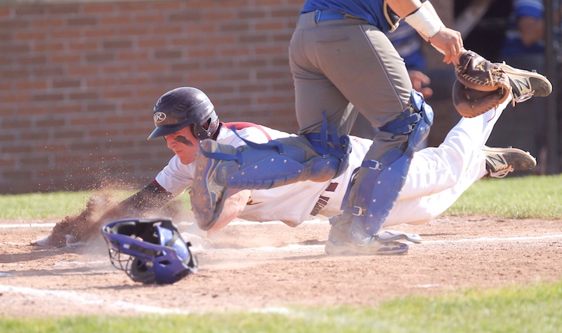 South Range baserunner Brycen James (5) slides safely into home plate during Friday’s win over Grand Valley at Massilon High School. Thursday, the Raiders will make their first appearance in the state tournament.