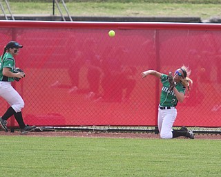 ROBERT K YOSAY  | THE VINDICATOR..West Branch Warriors - defeated Jonathan Alder Pioneers  - 5-4 where the lead changed hands several times .#7 Grace Heath throws from the warning track as #13 Hannah Sprague.. looks on..-30-