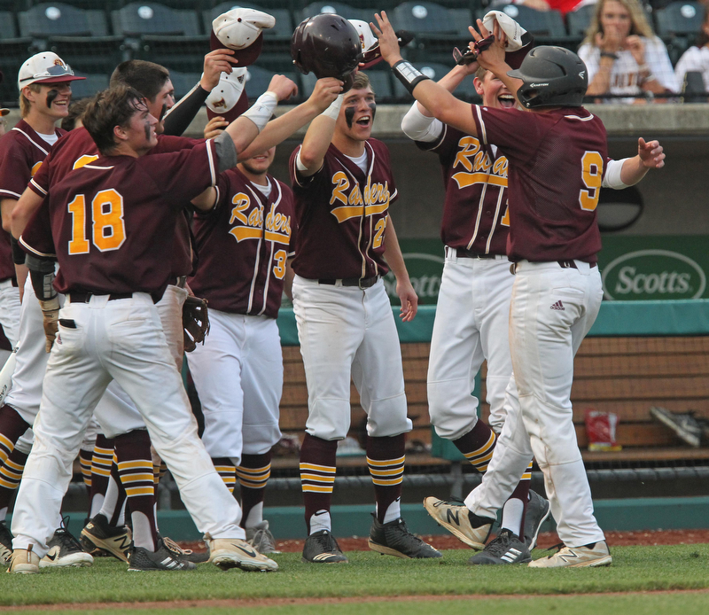 Jake Gehring (9) of South Range gets greeted by his teammates after hitting a 3-run double in the sixth inning during Thursday evenings State Semifinals matchup at Huntington Park in Columbus. Dustin Livesay  |  The Vindicator  5/31/18  Columbus