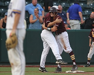 South Range senior first basemen Mike Cunningham (3) hugs his coach Jim Hanek after making it to third base and scoring a run in the sixth inning during Thursday evenings State Semifinals matchup against Madeira at Huntington Park in Columbus. Dustin Livesay  |  The Vindicator  5/31/18  Columbus