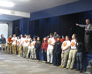 Neighbors | Zack Shively.Cardinal Mooney High School designed the Yes Fest as a way to promote a positive, healthy lifestyle without drugs use. Speaker Lt. Jered Sutton, Canfield Post Commander for the Highway State Patrol, gave the students information and statistics about drug use and drug-related deaths. Pictured, Sutton demonstrated how many people die in car crashes in a given year, represented by those standing, in comparison to the number of drug-related deaths, represented by the near 100 other students in the room.