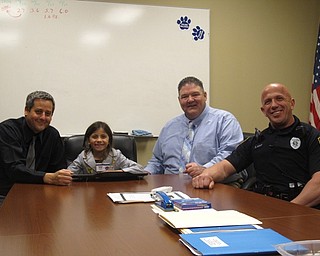 Neighbors | Zack Shively.Union Elementary principal Michael Masucci granted students a chance to become the principal for the day on April 25, 26 and 27. Pictured, Jayde Simon met with superintendent David Janofa. Pictured are, from left, Masucci, Simon, Janofa and resource officer Steve Kent.