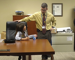 Neighbors | Zack Shively.Union Elementary's principal for a day program raised money for the school's contribution to Poland's Relay for Life team. Pictured, Jayde Simon, principal for the day on April 26, talked with high school principal Kevin Snyder.