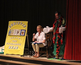 Neighbors | Abby Slanker.After dressing Hilltop Elementary School Principal Joe Maroni in clothing inspired by classic children’s books, Charn Creed, Hilltop first-grade teacher, read the students “The Little Principal Who Was Not Afraid of Anything” at the school’s CHRISTIE Campaign assembly.