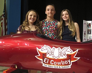 Neighbors | Zack Shively.Each of the students in the grade participated in the STEM projects of their grade level, such as the seventh and eighth grade's soap box derby cars. Both grades make three cas each to be raced in a derby later in the school year. Pictured are Isabella Larose, Peyden Grope and Elizabeth Jadue with one of the STEM program cars.