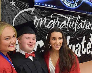 William D. Lewis The Vindicator  Canfield grad Thomas Beck shares a moment with fellow  grads Emerson Fletcher, left, and Christina Rivera before 6-1-18 commencement at CHS.