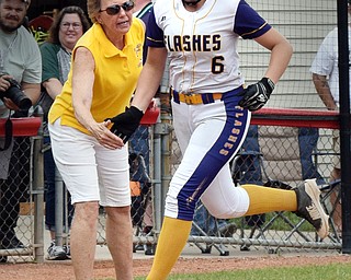 William D. Lewis Th Vindicator GAME WINNING RUN  Champion's Allison Smith(6) gets congrats from coach Cheryl Weaver while rounding 3rd after hitting homer in 8th inning during 6-1-18 win over North Union at Akron to advance to state championship game.