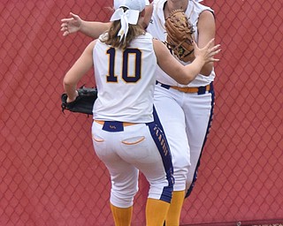 William D. Lewis Th Vindicator   Champion'Emma Gumount(1) gets congrats from Alayna Fell(10) after catching a long fly ball during 6-1-18 win over North Union at Akron to advance to state championship game.