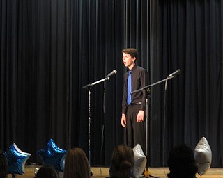 Neighbors | Zack Shively.Choir teacher Shannon Nicholson saw that the choir had done a dinner and concert in the past and had success with it, so she wanted to bring it back. Pictured, Noah landry performed at the concert after the dinner.