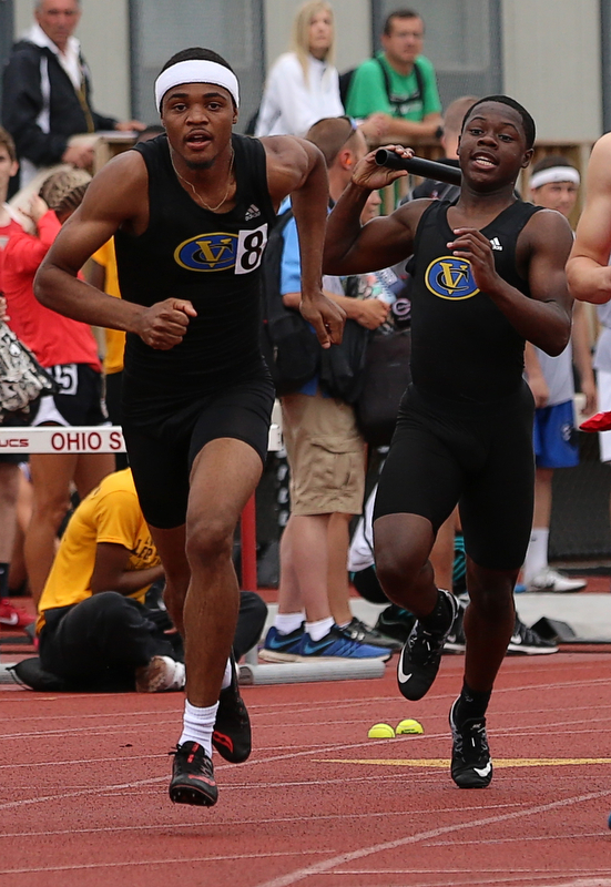 COLUMBUS, OHIO - June 1, 2018, OHSAA Track & Field Championships at Jesse Owens Stadium, Ohio State University-  D3 4x200 Youngstown Valley Christian's Jamynk Jackson hands the baton to his teammate Terrance White as YVC qualifies for the final.  SPECIAL TO | THE VINDICATOR