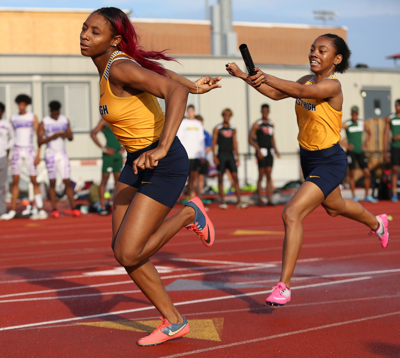 COLUMBUS, OHIO - June 1, 2018, OHSAA Track & Field Championships at Jesse Owens Stadium, Ohio State University-  D1 Youngstown East's Jahniya Bowers hands the baton to her teammate DeShante Allen as East qualifies for the 4x200m final.  SPECIAL TO | THE VIDICATOR
