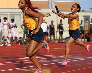 COLUMBUS, OHIO - June 1, 2018, OHSAA Track & Field Championships at Jesse Owens Stadium, Ohio State University-  D1 Youngstown East's Jahniya Bowers hands the baton to her teammate DeShante Allen as East qualifies for the 4x200m final.  SPECIAL TO | THE VIDICATOR