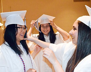 William D. Lewis The Vindicator  Poland grads (l-r) Nancy Lin, Renee Ho and Jenna DeLuca share a moment before commencement 6-2-18.