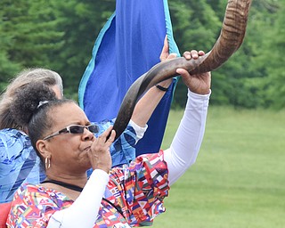 William D. Lewis The Vindicator  Debra Ingram of Youngstown sounds the shofar during Unity Parade 6-2-18. The shofar is a rams horn played like a bugle.