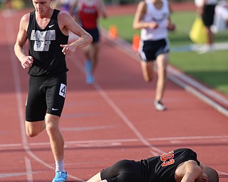 COLUMBUS, OHIO - June 2, 2018, OHSAA Track & Field Championships at Jesse Owens Stadium, Ohio State University-  D1 3200m Howland's Vincent Mauri collapses after his 3200m 2nd place state finish. SPECIAL TO | VINDICATOR