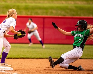 DIANNA OATRIDGE | THE VINDICATORÊ West Branch's Grace Heath slides into a force out by Keystone's Val Broschk at third base during the Division II State Championship in Akron on Saturday. Keystone won 3-2 in 12 innings.Ê.