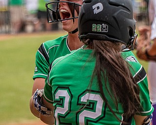 DIANNA OATRIDGE | THE VINDICATORÊ West Branch's Kylie Coffelt (17) and Sam Morris (25) celebrate at home plate after they scored the tying runs in the bottom of the seventh to force extra innings during the Division II State Championship game against Keystone in Akron on Saturday. Keystone went on to win 3-2 in twelve innings..