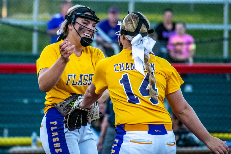 DIANNA OATRIDGE | THE VINDICATORÊ Champion's Sophie Howell (right) congratulates pitcher Allison Smith (left) after a strikeout during the Division III State Championship in Akron on Saturday.