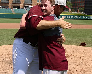 South Range team manager Brendan Miller hugs head coach Jim Hanek after the Raiders defeated Coldwater in the State Championship game at huntington Park in Columbus. Dustin Livesay  |  The Vindicator  6/2/18  Columbus