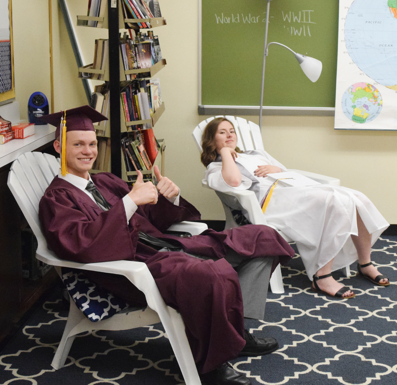 William D. Lewis The Vindicator Taking it easy before start of Boardman commencement at grads Sean Buck and Annaliisa(correct) Cordova.