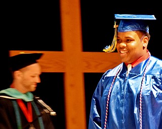 William D. Lewis The Vindicator    Valley Christian grad Randy Madison walks across the stage to recieve his diploma during 6-3-18 commencement at Highway Tabernacle.