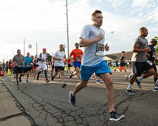 Scott R. Galvin | The Vindicator.Joseph Safarek of Canfield leaves the starting line for the beginning of his 5K run during the first inaugural Youngstown Marathon on Sunday, June 3, 2018.