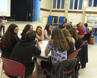 Neighbors | Zack Shively.The Kiwanis Club Trivia Night saw many different teams compete against each other. These teams included people of all ages, ranging from veterans to school students. Pictured, the high school's Key Club discusses their answers.
