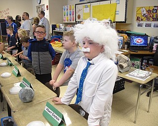 Neighbors | Zack Shively.Jacquelynne Moretti organized the wax museum presentations by theme. She had "Women in History, "Men in History", "Entertainment," "Science" and "Sports." Pictured are the science section, including Kevin as Steve Jobs, Jayden as Neil Armstrong and Liam as Albert Einstein.
