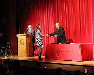 Neighbors | Abby Slanker.Canfield High School Principal Mike Moldovan congratulated junior Gianna Flask as she accepted her Academic Awards certificate at the Canfield Parent-Teacher Association’s 35th annual Academic Awards Program on May 3.