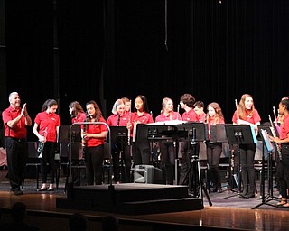 Neighbors | Abby Slanker.Canfield Village Middle School Band Director James Volenik (left) applauded the seventh-grade band at the end of their performance at the annual spring concert at the Canfield High School on May 9.