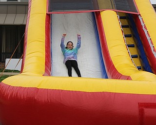 Neighbors | Abby Slanker.A Hilltop Elementary School third-grader had a blast sliding down the inflatable bouncy slide during the school’s annual Student Appreciation Day on May 11.