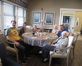 Neighbors | Zack Shively.The families at The Inn at Poland Way ate lunch together in different dining areas throughout the facility. They ate sandwiches, egg salad and a dessert. Pictured are the Guidos and Tribby families dining together.