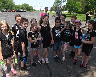 Neighbors | Zack Shively.Stadium Drive Elementary School had their annual field day event where the students got a chance to play outside for hours. Pictured, Nina Zordich's second-grade class took some time to cool off in the shade and get their faces painted.