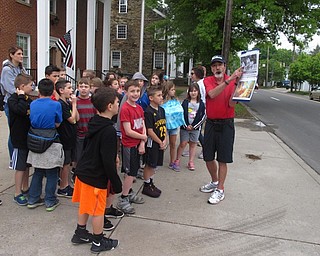 Neighbors | Zack Shively.Four volunteers from the Poland Historical Society led the third-grade students on a guided tour of the community. Sites included town hall, the Village Green and the former home of President William McKinley. Pictured, president of the society Larry Baughman taught the Dobbins students about the fire station.
