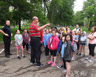 Neighbors | Zack Shively.The Dobbins walking tours ended at Baird Mitchell Field, which followed with a lunch at the Village Green. Pictured, the students learned about the local cemetery.