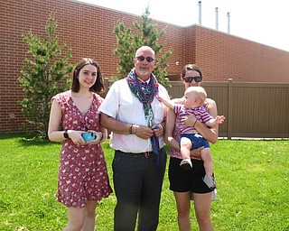 Neighbors | Zack Shively.Principal Thomas Lenton did not know that the school was going to honor him at the end of the last day. On top of the event, his daughters and grandson surprised him at the event as well. Pictured are, from left, Hillary, Thomas and Beatrice Lenton, along with William Lyons.