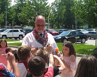 Neighbors | Zack Shively.Austintown Elementary's PTA and staff organized the surprise event to honor principal Thomas Lenton. They snuck the students out of the building while Lenton was in a meeting. When Lenton walked outside, the students and staff cheered for him.