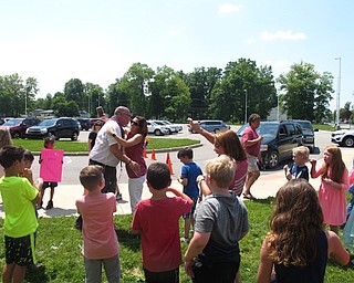 Neighbors | Zack Shively.Austintown Elementary School thanked principal Lenton for all he has done during his time as a principal. He walked around the school where the students gave him high fives and the staff members hugged him.